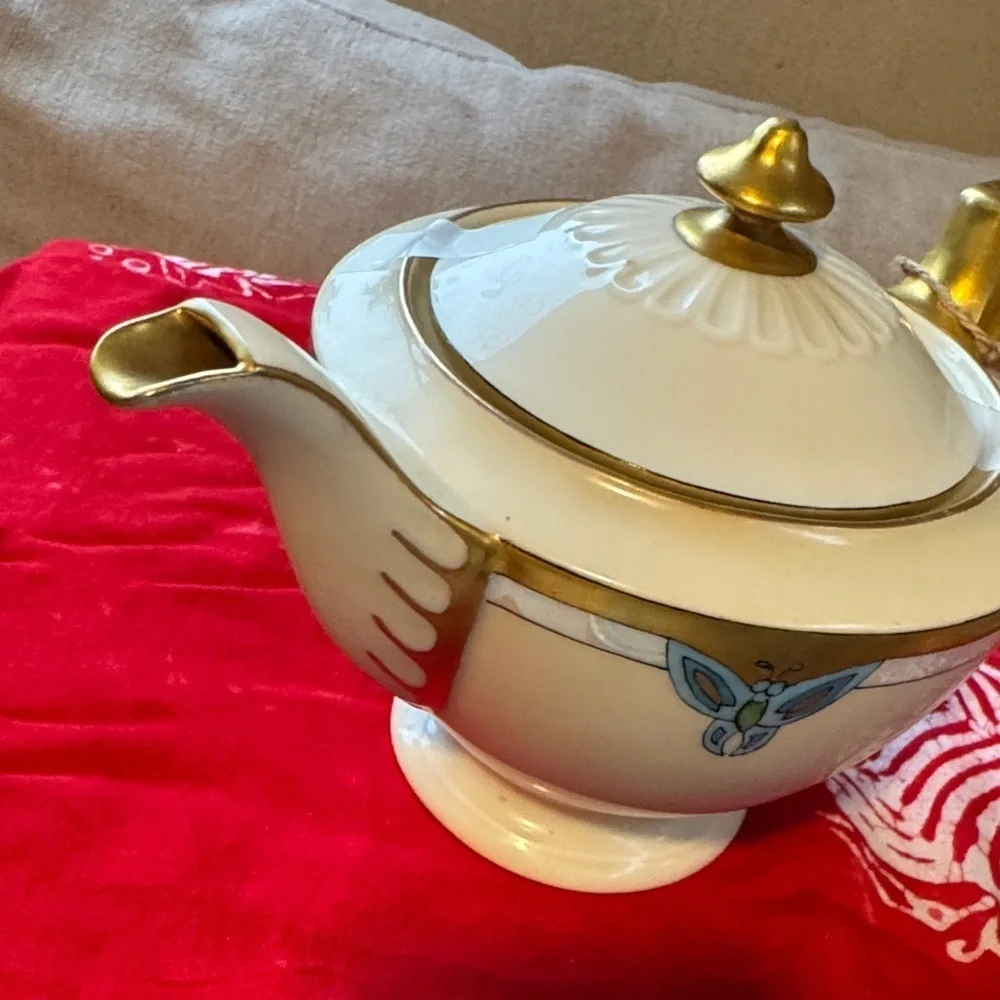 Elegant Gold and Cream Teapot with Blue Accents